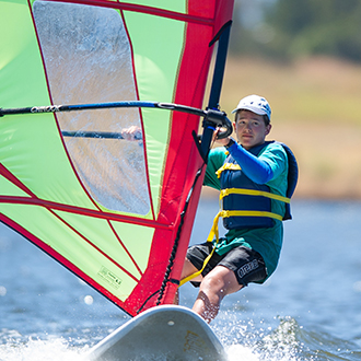  A boy windsurfing