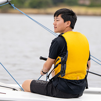 A boy in a sailboat
